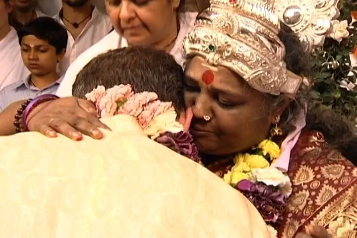 Amma giving Darshan blessing to the author symbolizing divine love and spiritual awakening