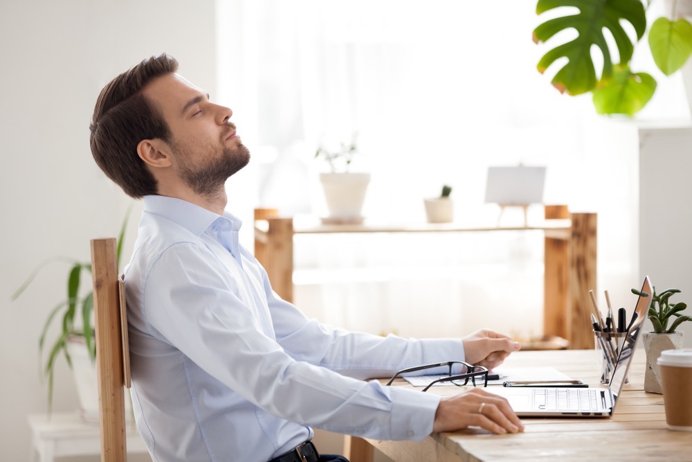 Image showing man at desk, stressed with work