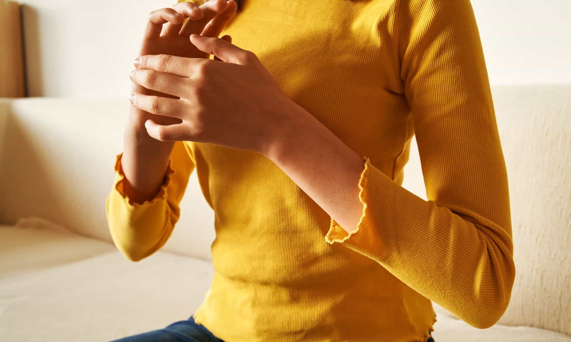 Woman using EFT tapping for healing - Paul Wagner