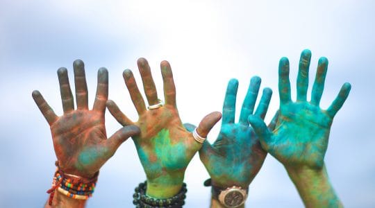 Painted hands reaching up, enchantment - Paul Wagner