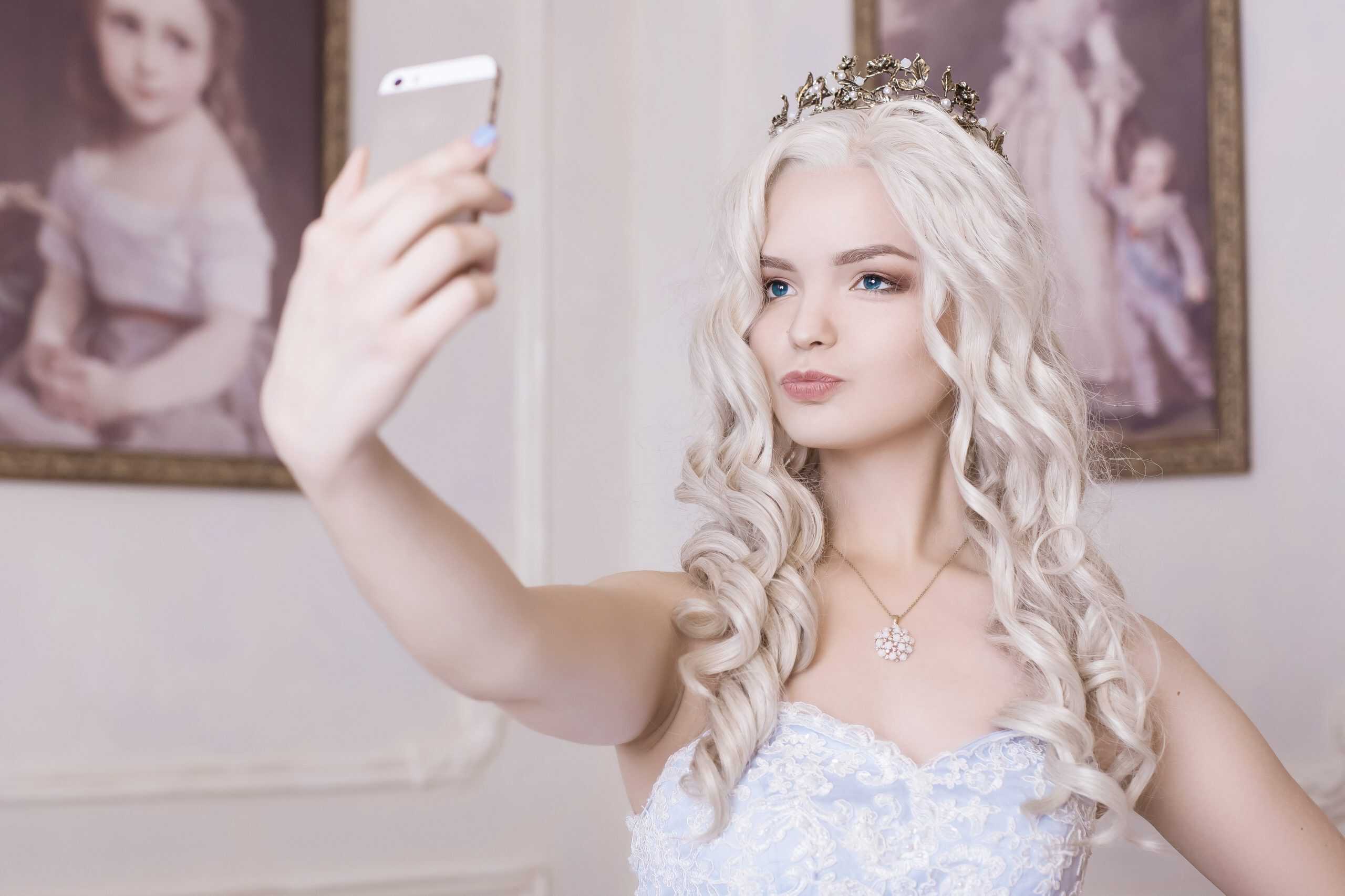 Woman taking selfie to convey narcissism — Paul Wagner