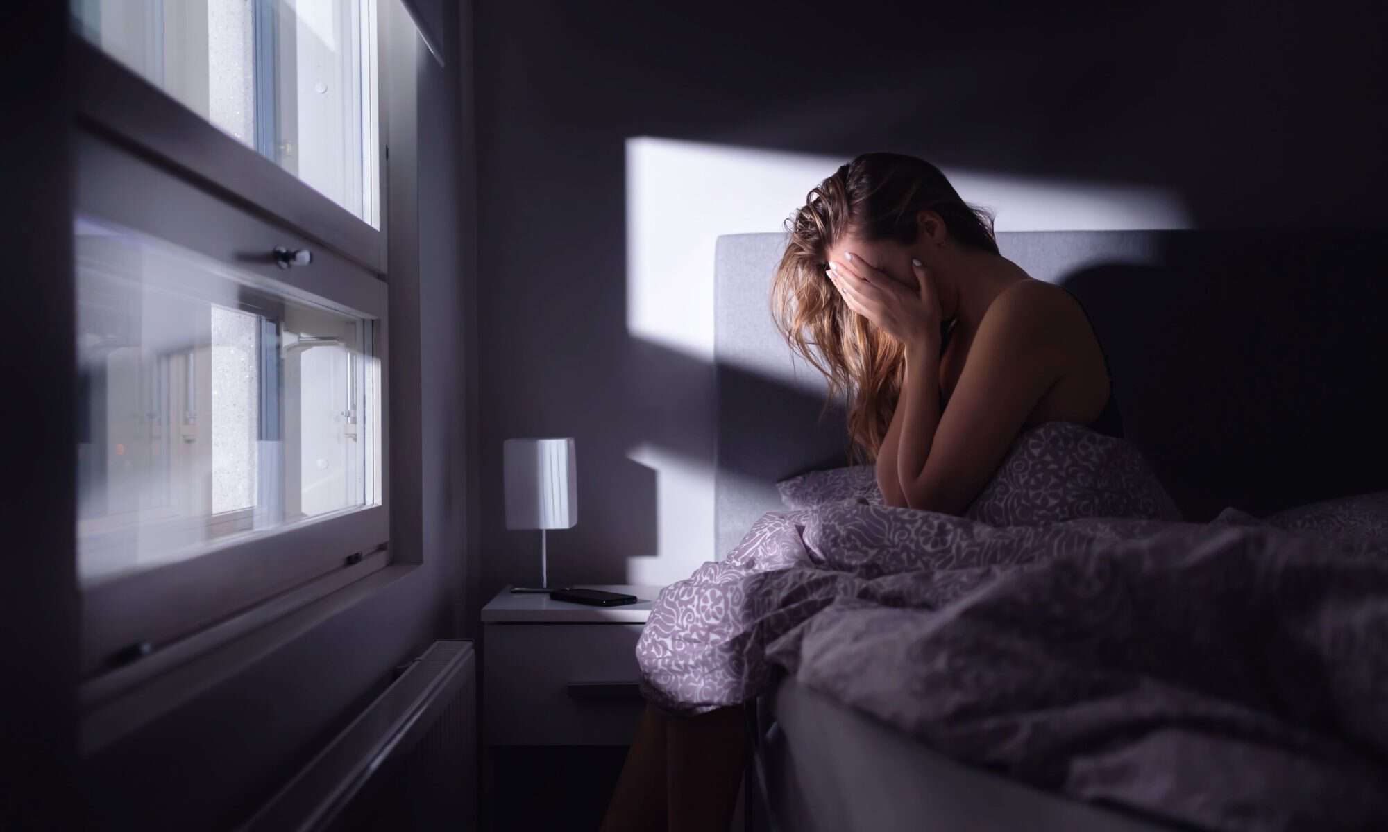 Image of woman struggling with anxiety to convey natural remedy for panic attacks and anxiety - Paul Wagner
